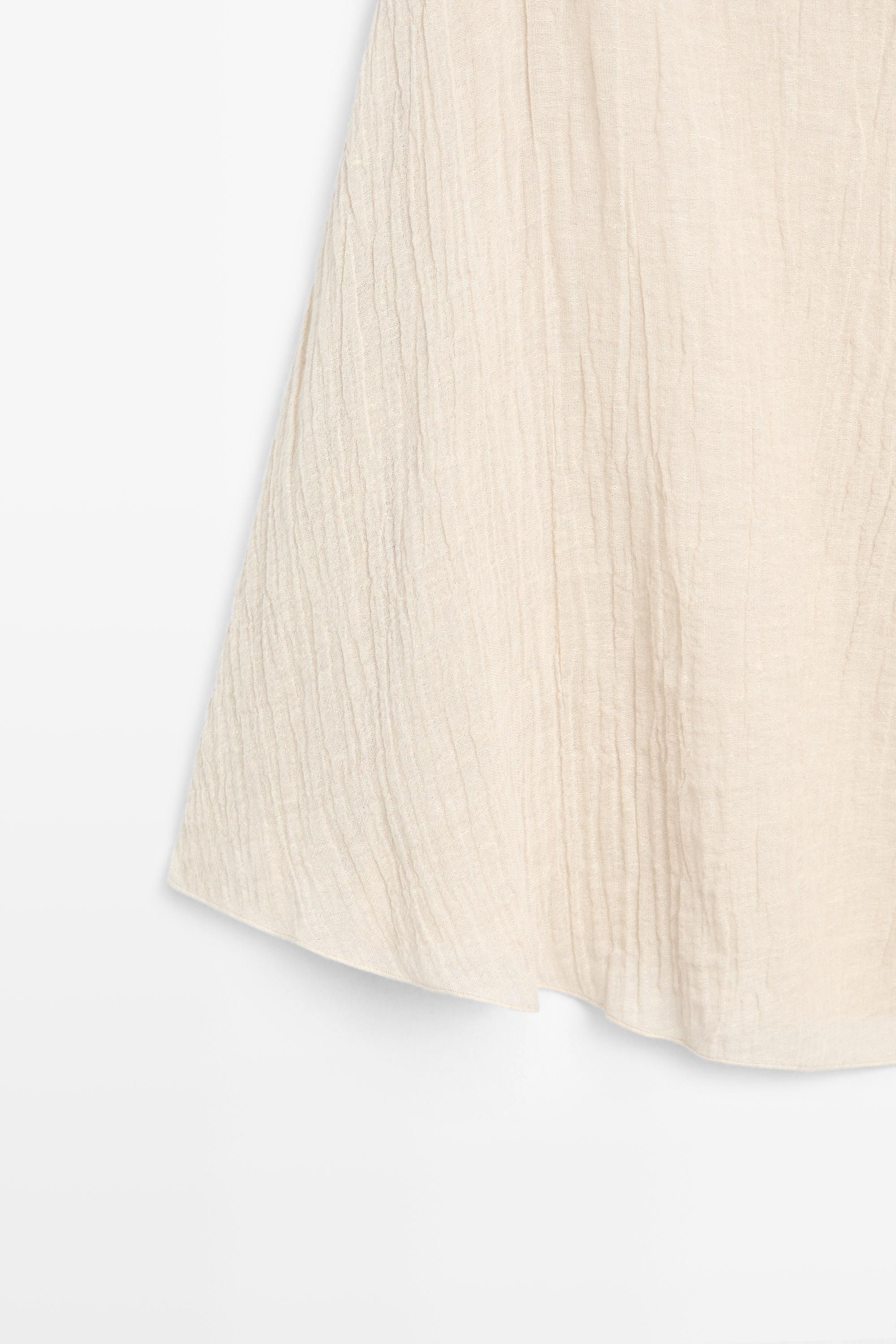 Total look asymmetric linen blend cape top